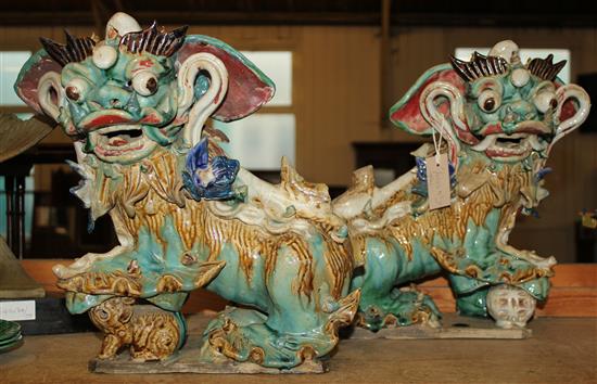 Pair of Chinese glazed pottery figures of Dogs of Foe